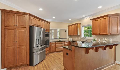 Large open kitchen allows the chef to connect with his guests on both sides of the home.