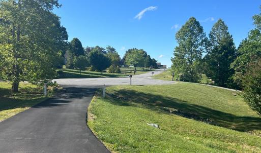 Cul de sac lot with paved drive. Street view from front yard.