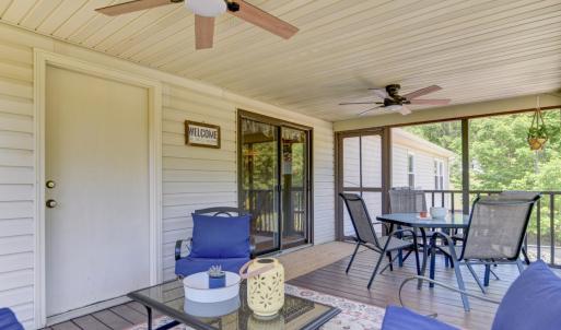 Screened in Porch with access to bathroom, outside exposed deck and lower level pool
