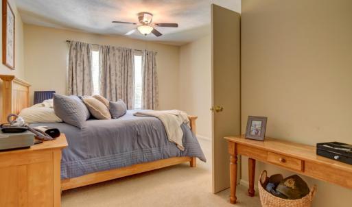 Primary bedroom with added seating, make-up or reading nook.