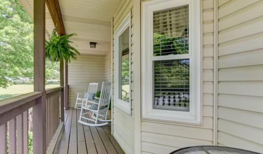 front entry porch with table seating area at the end.