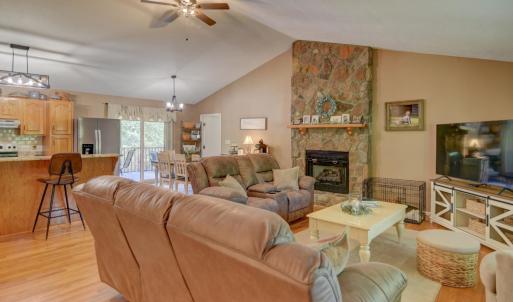 Main level open floor plan with access to large screened in porch, with exterior entrance into bathroom for pool guests