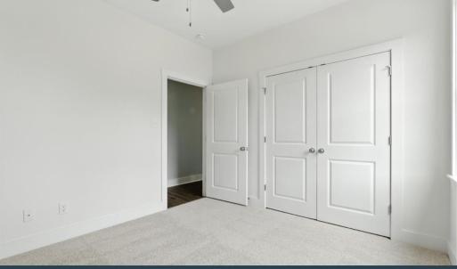 Bedroom 3 with carpet and ceiling fan