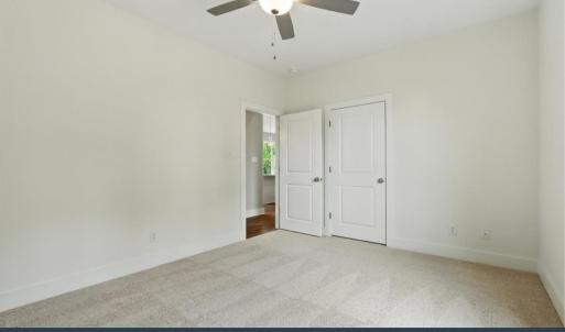 Bedroom 2 with carpet & ceiling fan