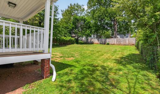 Fresh and bright bungalow with charming covered front porch.