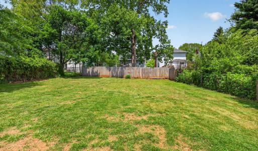 Beautiful open, flat backyard. fully fenced and ready to garden or add a play yard! Wonderful for hosting.