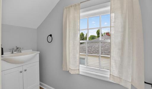 Upstairs half bath, fully updated, including window view.