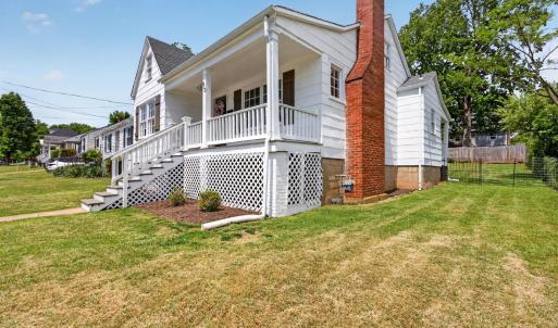 Fresh and bright bungalow with charming covered front porch.