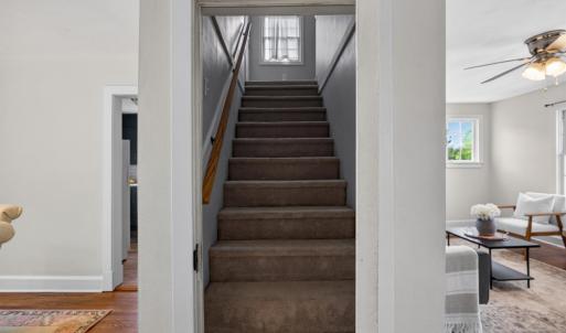 Door leading upstairs to a fully private loft bedroom.