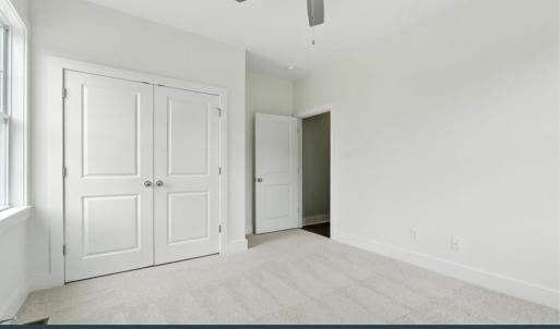 Bedroom 4 with carpet and ceiling fan