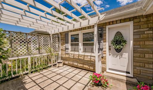 Pergola on spacious front porch