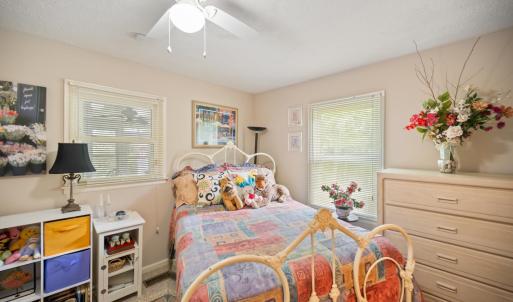 Private bedroom situated adjacent to the home office, ideal for guests or a private workspace suite.