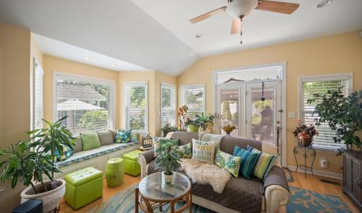 Gorgeous sunroom with walkout to pool. Lots of natural light!