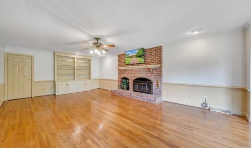 Huge rec room with fireplace.  This room can be closed off by doors from the remainder of the home.  You can make good use of the built-ins