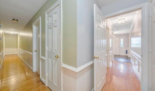 Hallway off the foyer and hallway leading to the bedroom area