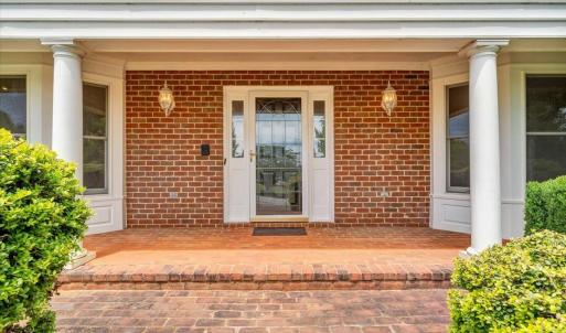 A large brick porch welcomes you