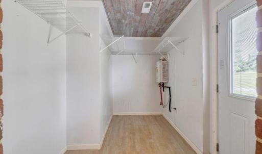 Enter into the home through mud room, which leads to the laundry room