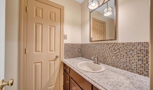Jack and Jill half bath on the main level can be accessed from the rec room or from the hallway
