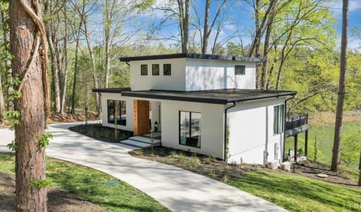 Whether you’re seeking a full-time residence, a private retreat, or an income-producing investment, this exceptional new construction seamlessly blends modern architecture with high-end finishes.