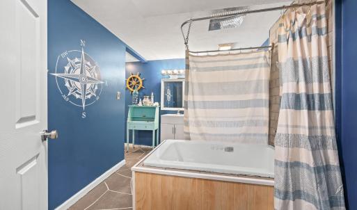 downstairs full bath. Jacuzzi tub with shower ring