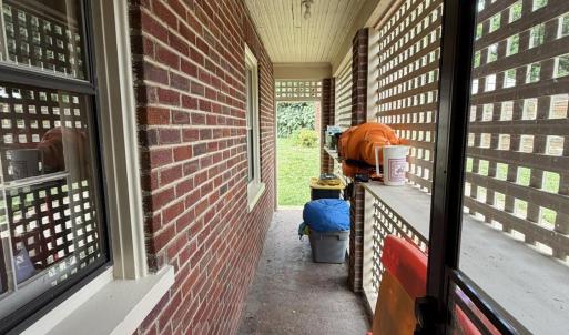 Enclosed area when exiting Kitchen door to back yard with helpful storage.