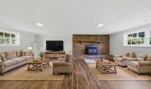 Virtually staged basement recreational room.