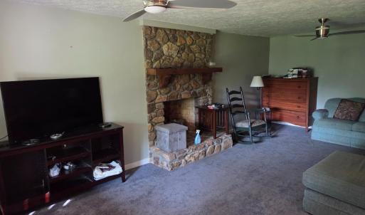 Den with rock fireplace