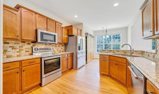 Spacious kitchen offers tons of cabinetry, granite counter tops, and stainless appliances!