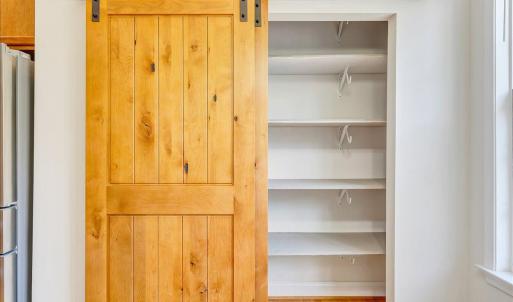 Pantry with barn door perfect for extra storage!