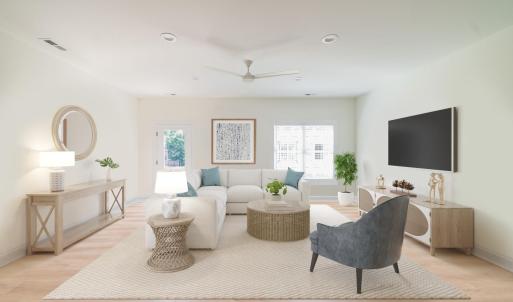 Living room with door to exterior patio.  Similar to photos.
