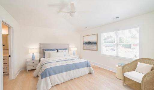 Primary Bedroom with vaulted ceiling and natural light.  Similar to photos.