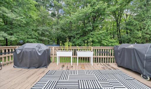 The oversized deck looked out into a mostly level backyard!