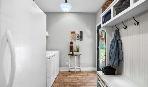 Separate laundry and drop zone right off the back patio and kitchen.