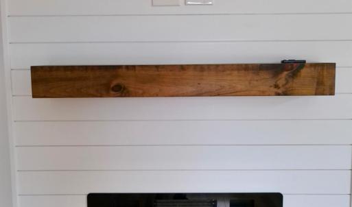 Safe and beautiful fireplace feature! Also notice, electrical and cable ready for no show wires. Keeping the look clean!
