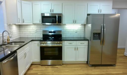 Kitchen is sleek and clean.