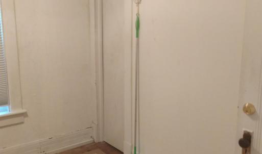 Door to walk-up attic in the kitchenette