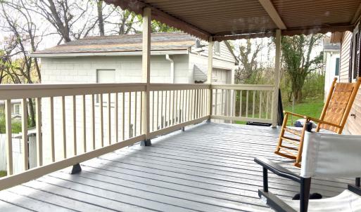 COVERED BACK PORCH OFF OF DINING ROOM OVERLOOKING FENCED BACKYARD