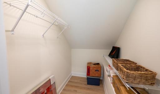 Walk in closet in upstairs bedroom.