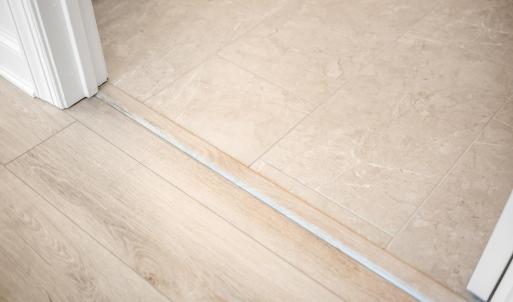 Neutral tile floor in primary bath ensuite