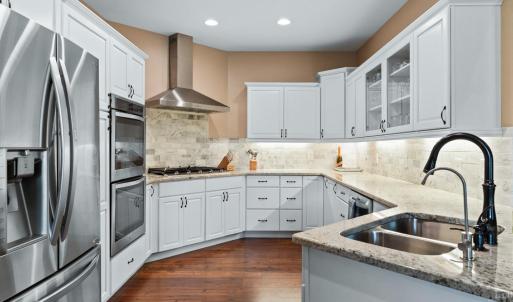 Kitchen with KraftMaid cabinets and under cabinet lighting.