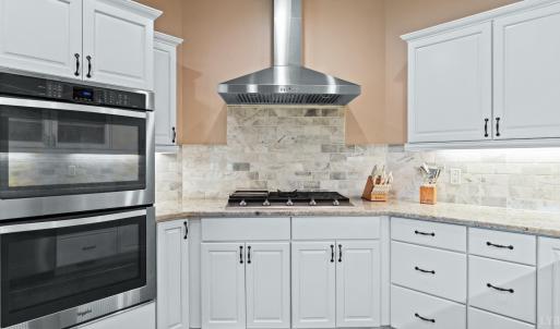 Gas range and double ovens.