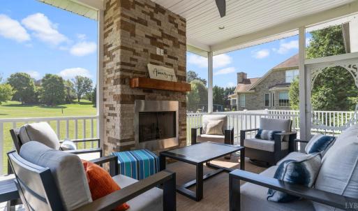 Screened porch with gas fireplace.