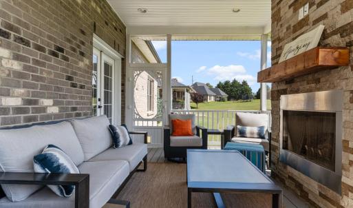 Screened porch with gas fireplace.