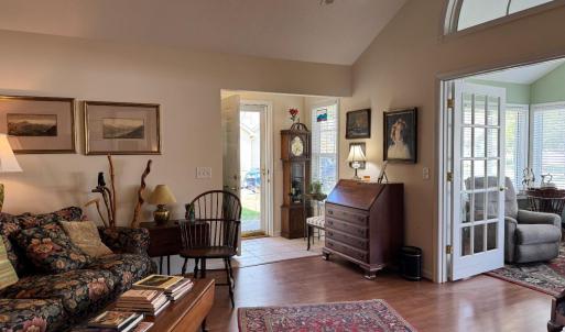 Walking into the front door you enter the Greatroom with the Vaulted Ceiling and the Fabulous Sunroom on the right.