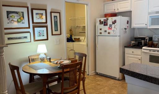 The kitchen area is large enough for a large hutch (on left in pictures), a kitchen table. I the back left corner is the laundry area