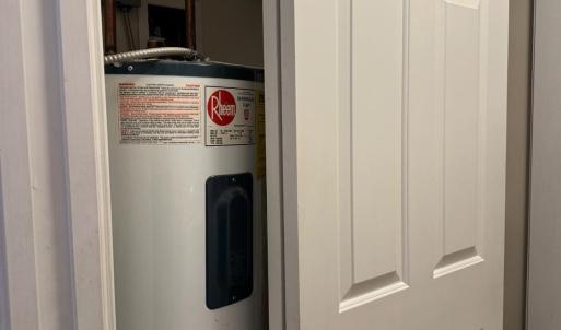 Large Pantry cupboard holds the Reem water heater and...