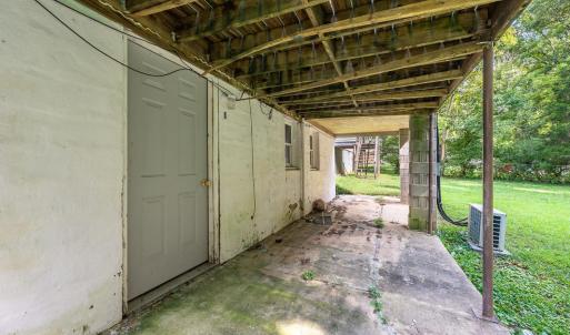 Door to the lower level which has been framed out, has it's own electric meter and also a plumbed out bathroom. Materials convey.