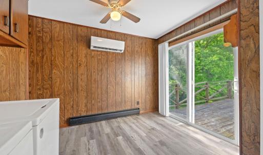 Eating area past the appliances and counters. Slider door to back deck to go out and enjoy nature right in front of Blackwater Creek!