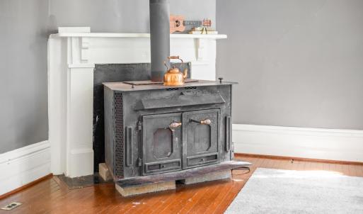 Wood stove in the living room conveys.