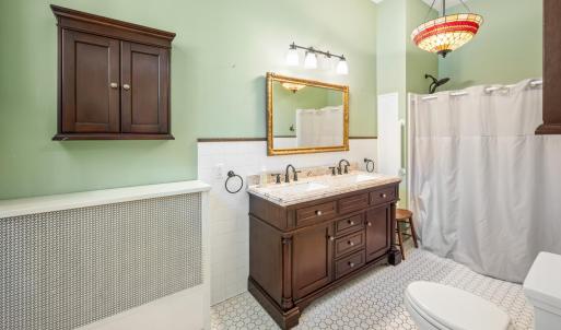 Full spacious bathroom conveniently attached to main level bedroom (ensuite).